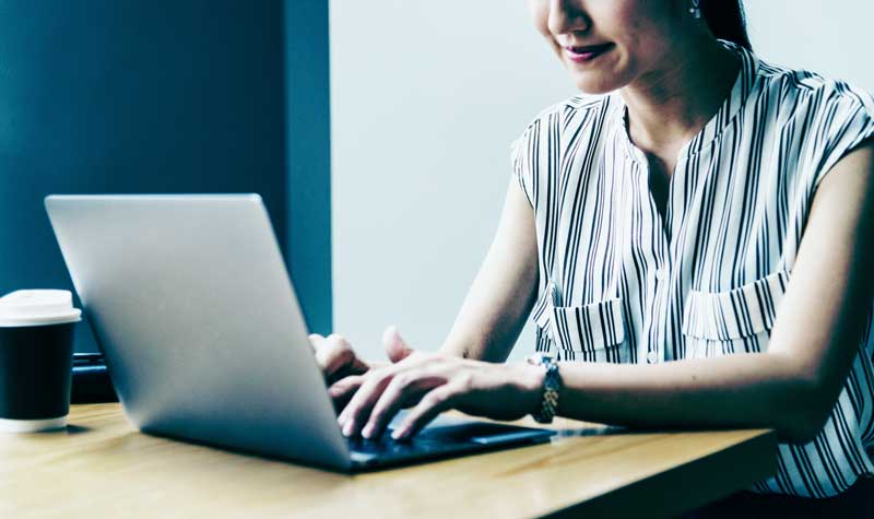 Woman working at a laptop