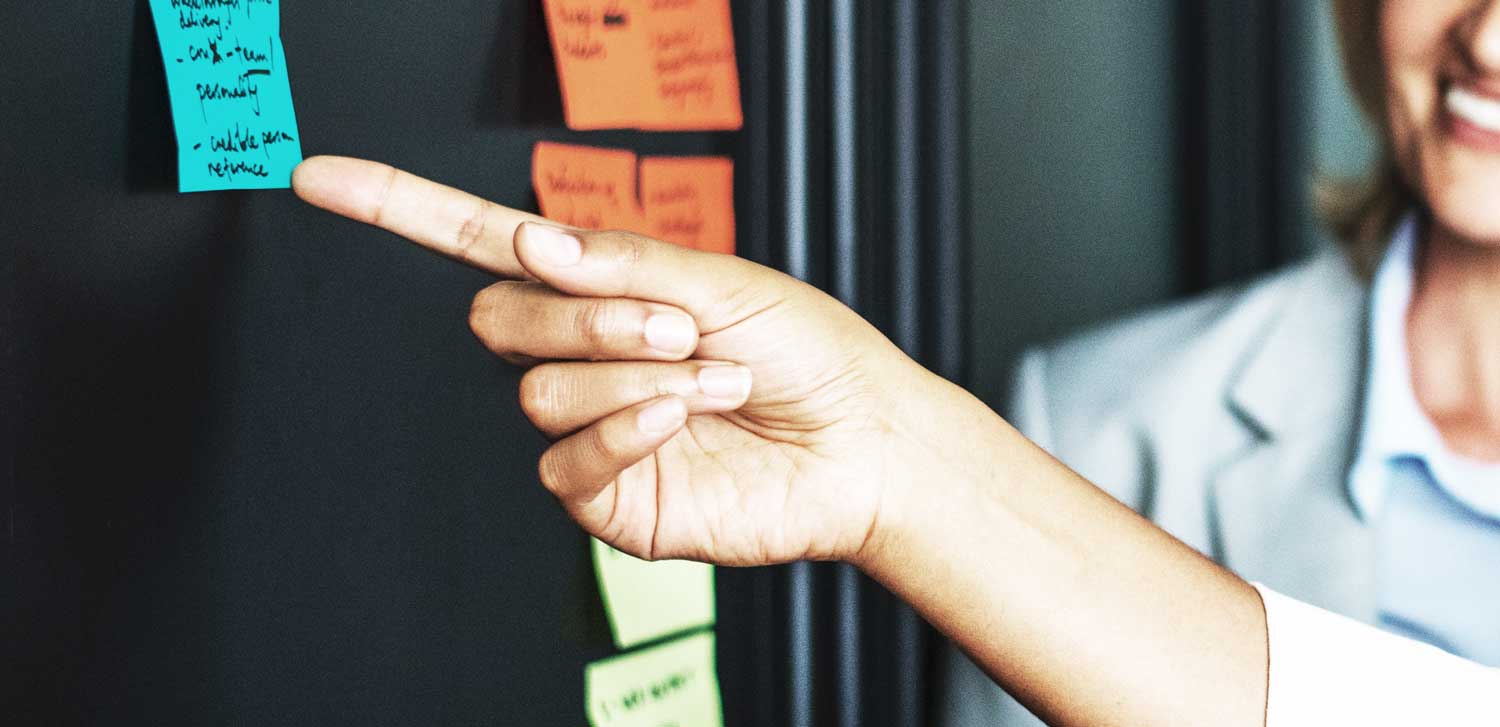 Woman pointing to a note